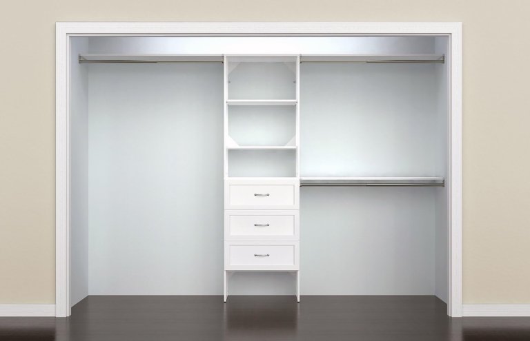 The ClosetMaid SuiteSymphony Wood Closet Organizer Kit installed in an empty reach-in closet