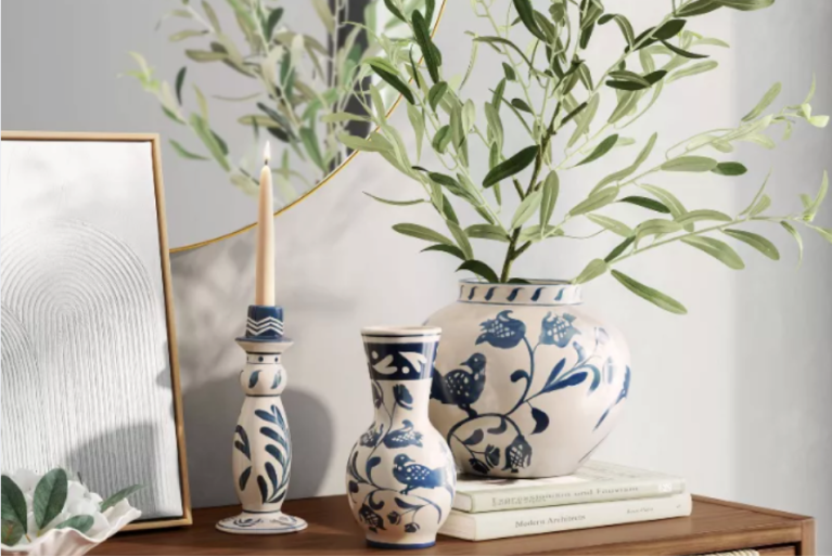 Painted blue and white vases on side table.
