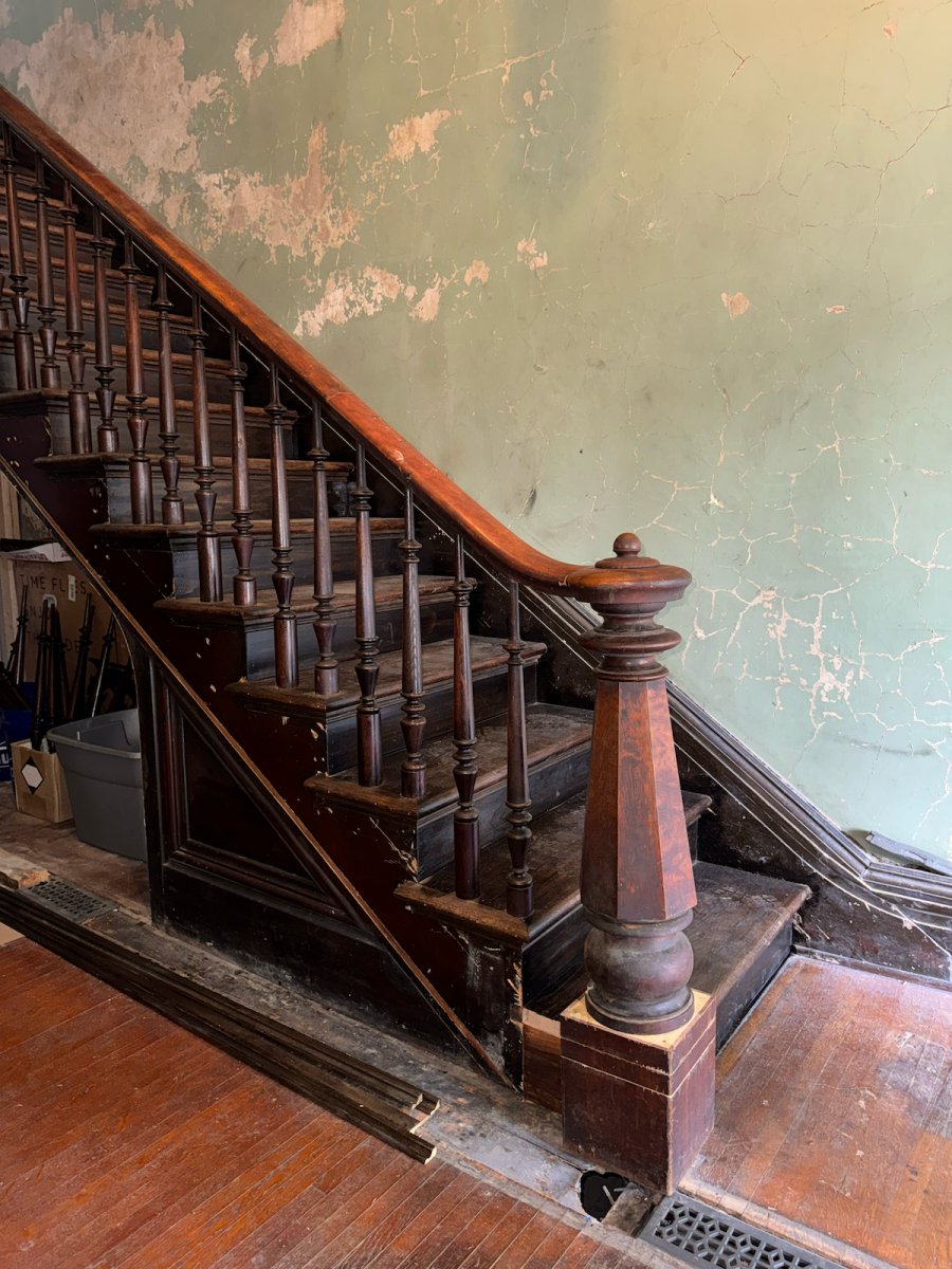 Hidden staircase trim revealed after wall removed.