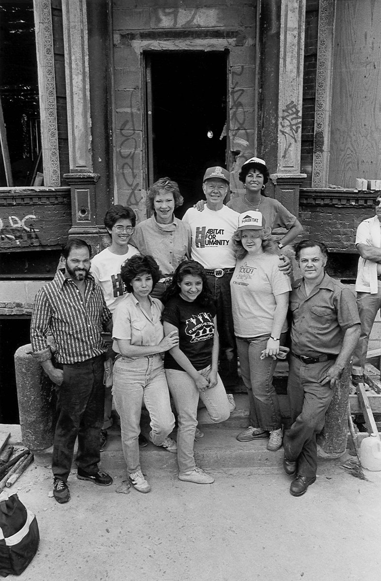 Jimmy and Rosalynn Carter with tenants of a New York apartment building ready to be renovated.