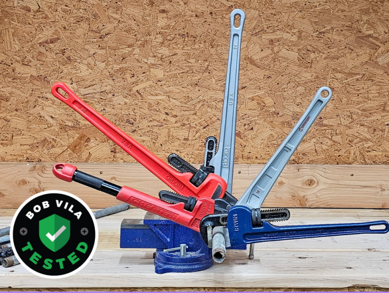 Five of the Best Pipe Wrenches on a wood work surface