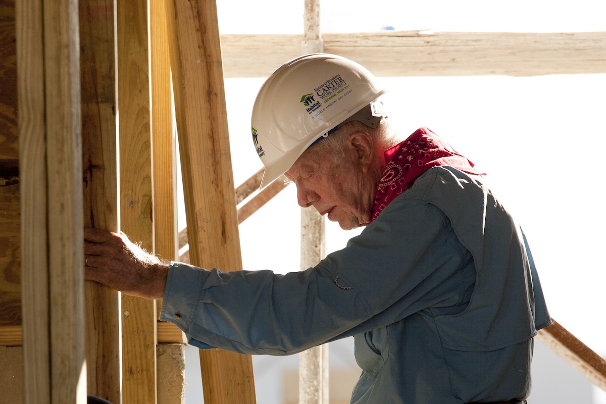 Former President Jimmy Carter building a home with Habitat for Humanity