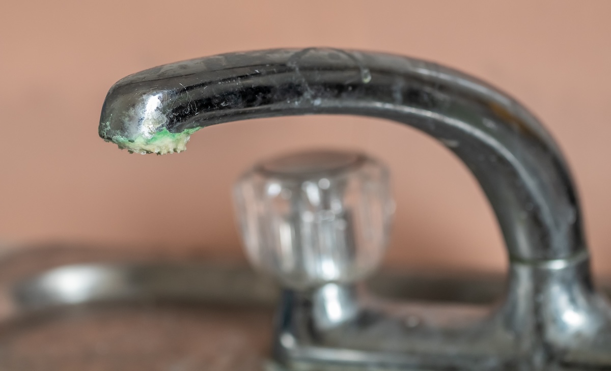 Acidic corrosion on a sink faucet.