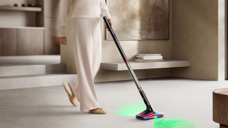 Woman cleaning floor by pushing Dyson’s PencilWash™ Wet Cleaner