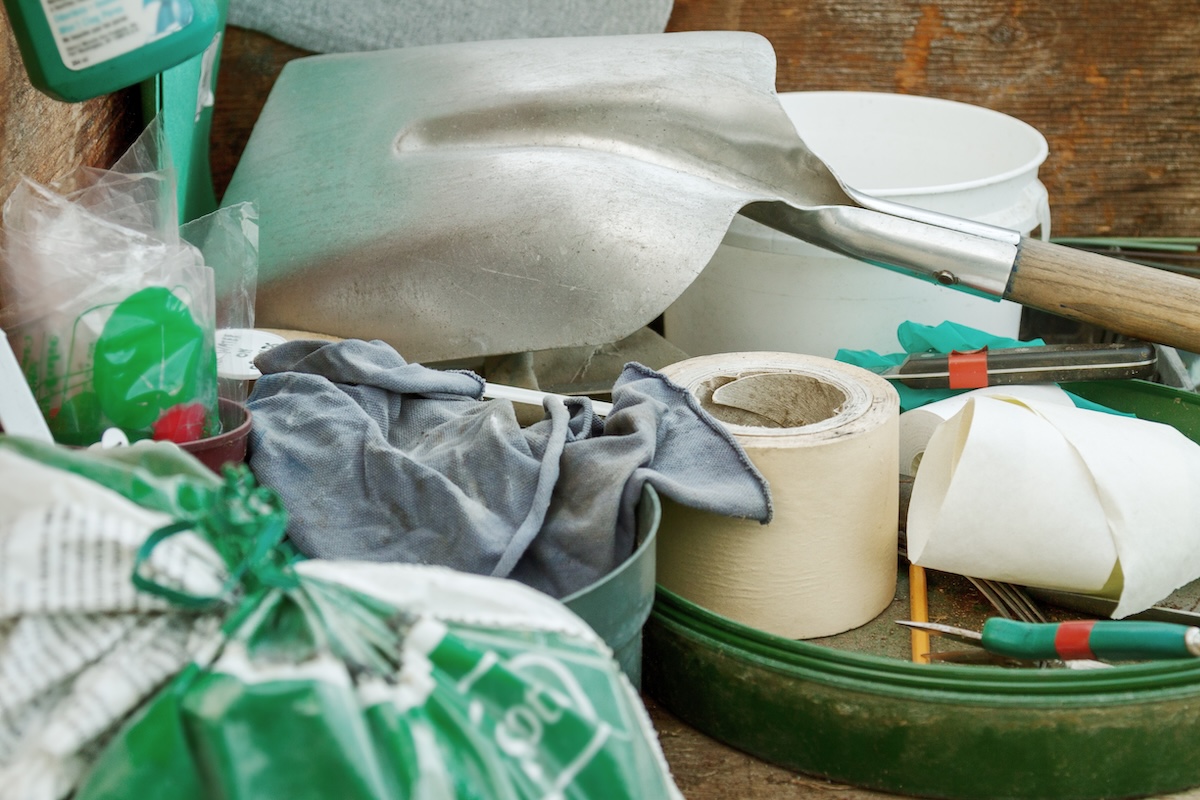 A messy pile of gardening supplies.