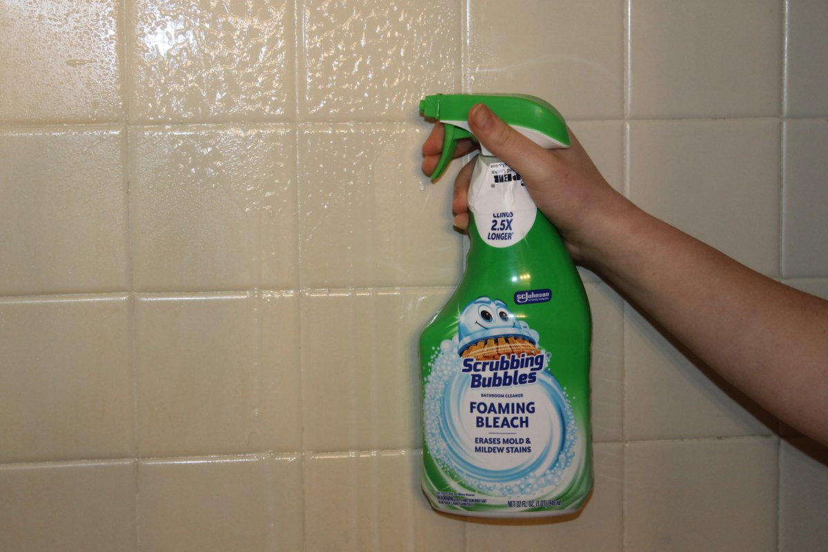 Scrubbing Bubbles Foaming Bleach sprayed on shower tiles