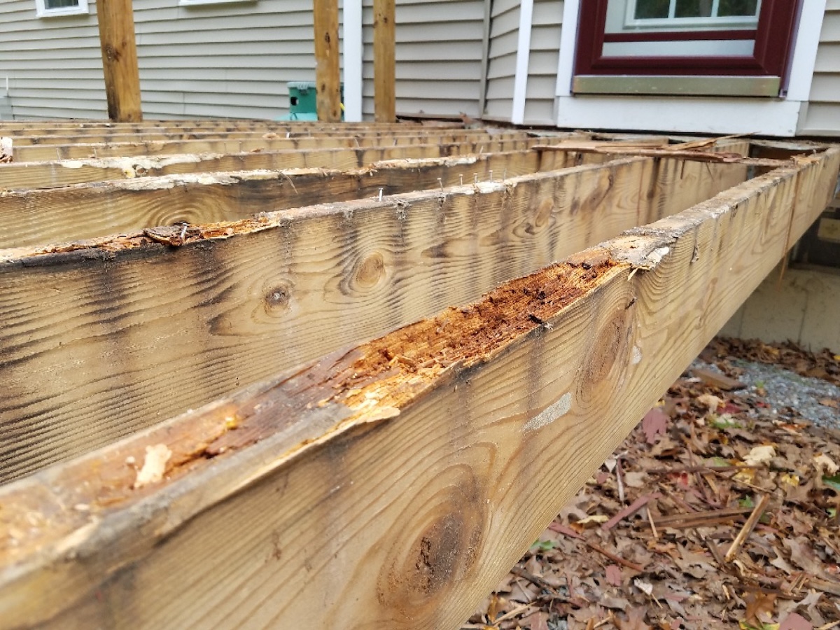 An old wood deck showing signs of wear and tear.
