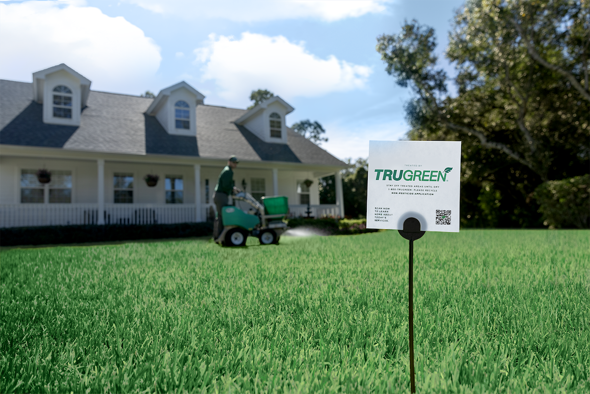 A TruGreen expert overseeding a customers lawn.