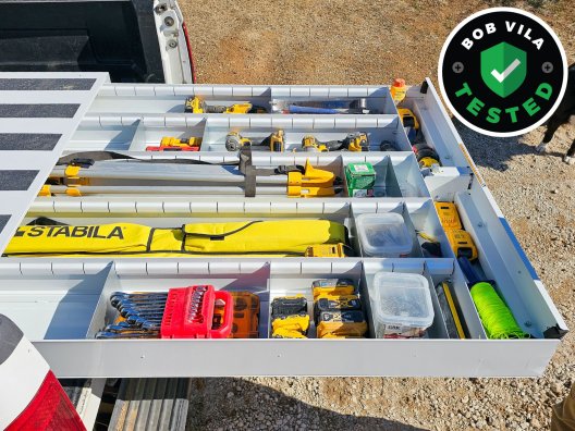 The Weather Guard Truck Bed Tool Box installed and open to show its full of tools