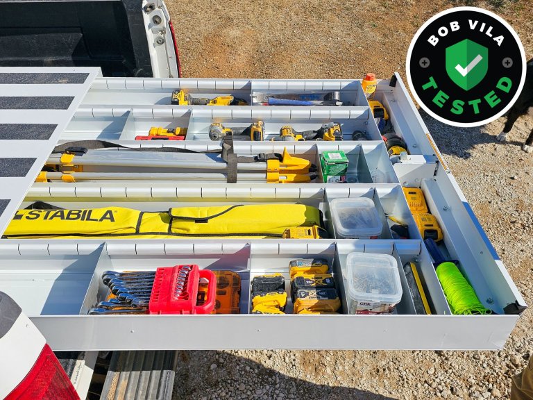 The Weather Guard Truck Bed Tool Box installed and open to show its full of tools