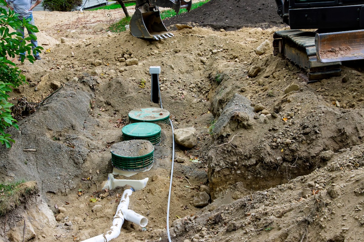 Septic lines and tank top dug out under the ground.