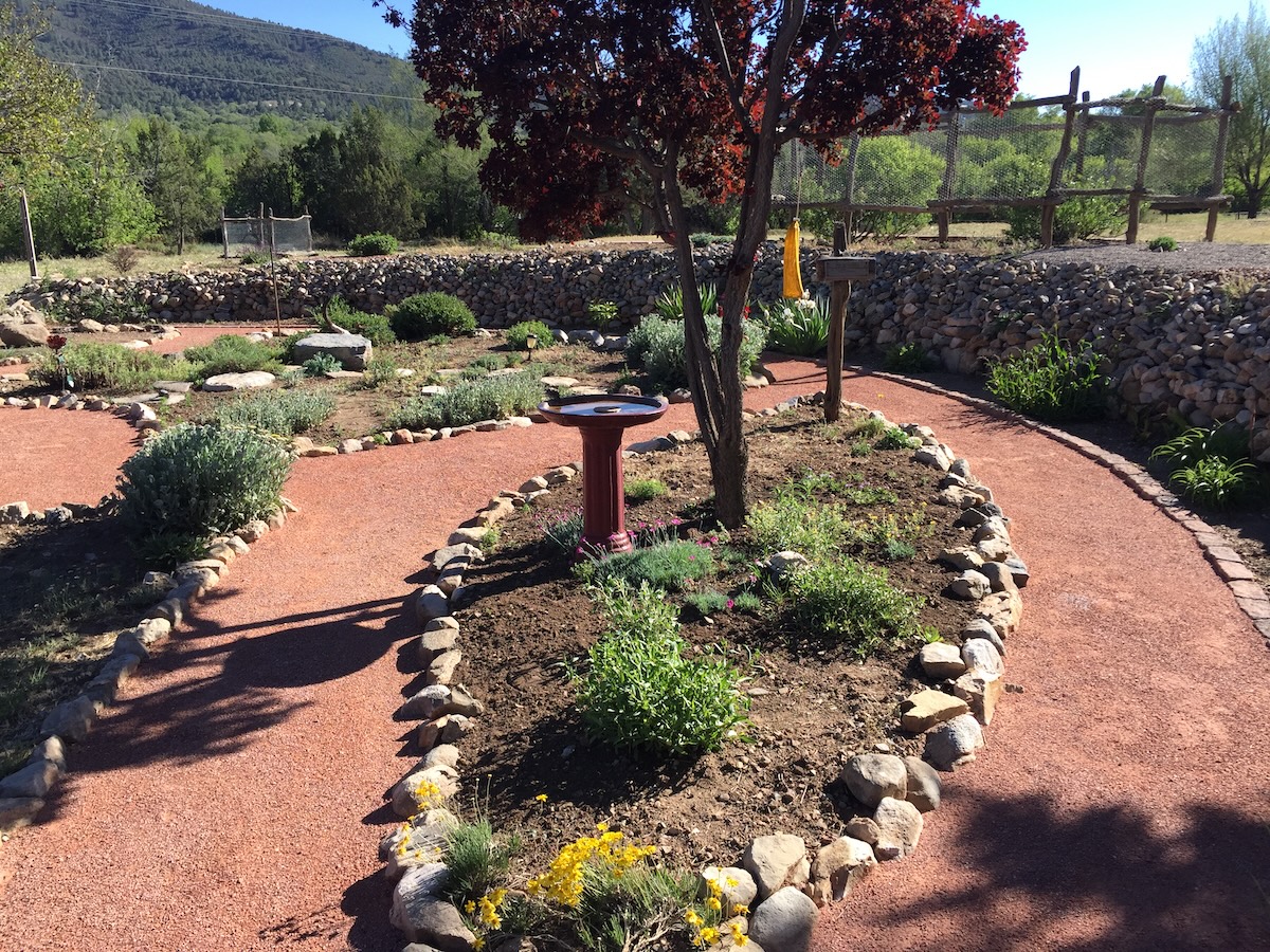 Crusher fines pathways in a home garden landscape.