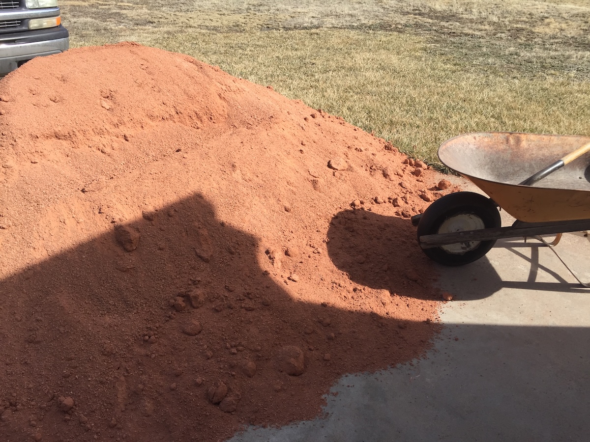 A large pile of crusher fines for a DIY garden path project.