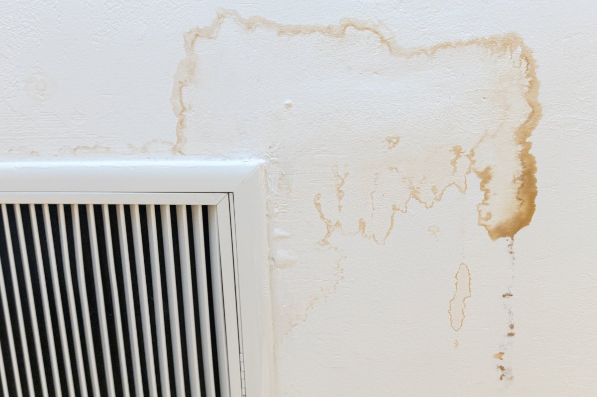 Ceiling stain next to air conditioning vent.