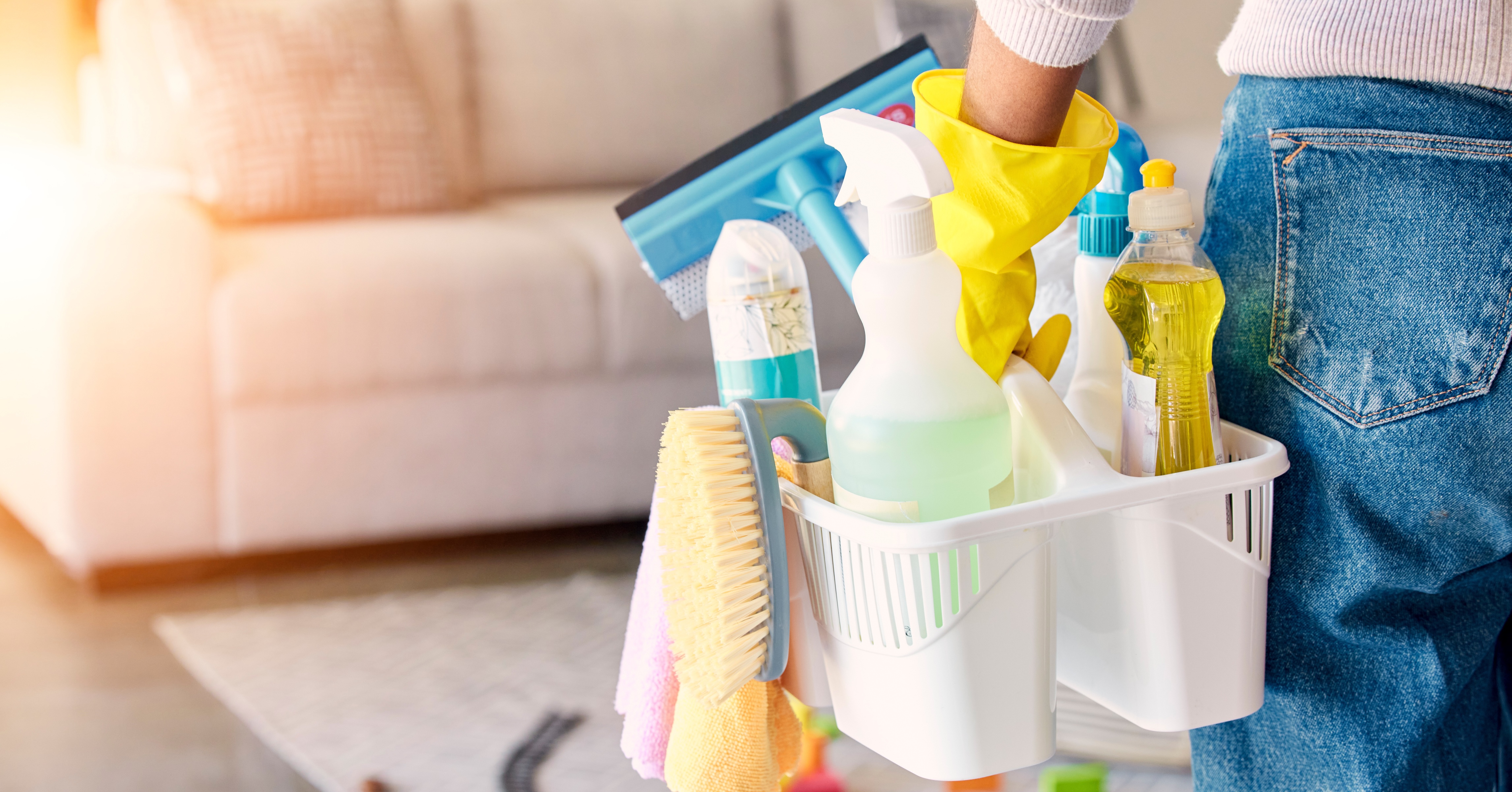 Woman, cleaning supplies and housekeeper about to clean a home for spring cleaning.