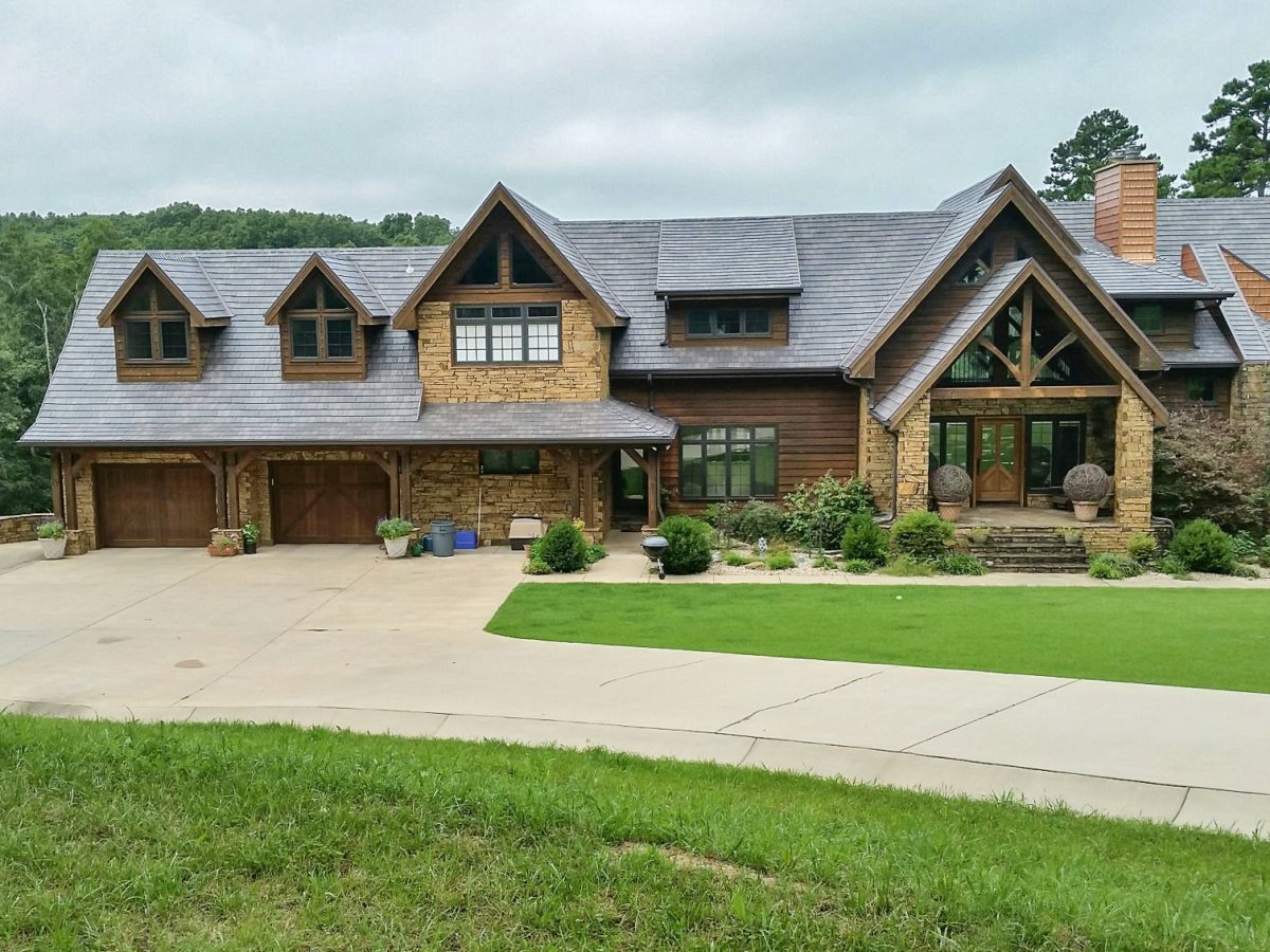 A Craftsman-style home featuring a shake-like metal roof to match the house style.