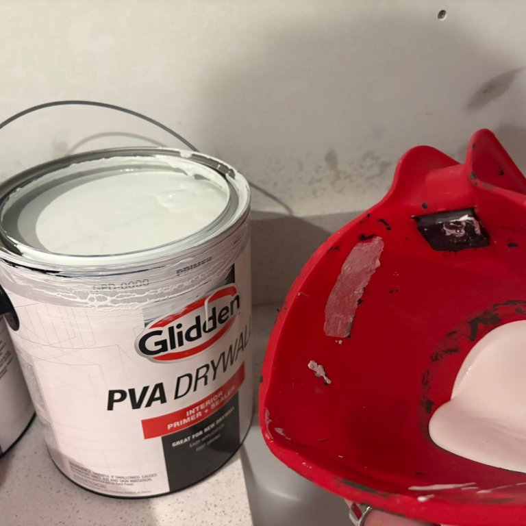 Glidden PVA Drywall Primer and Sealer in a paint bucket during testing