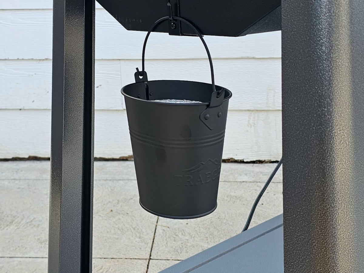 Grease bucket hangs neatly underneath