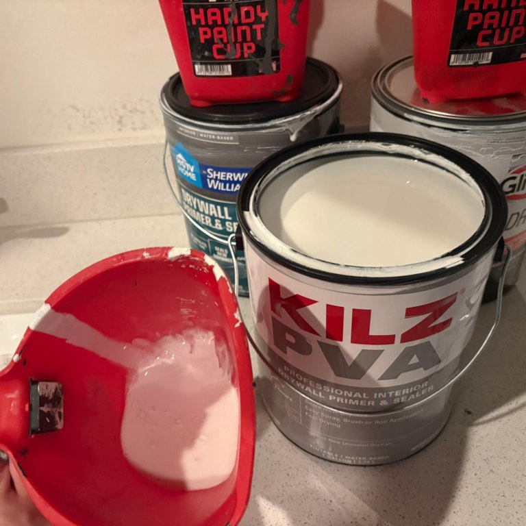Kilz Drywall Primer and Sealer poured into a paint bucket for testing