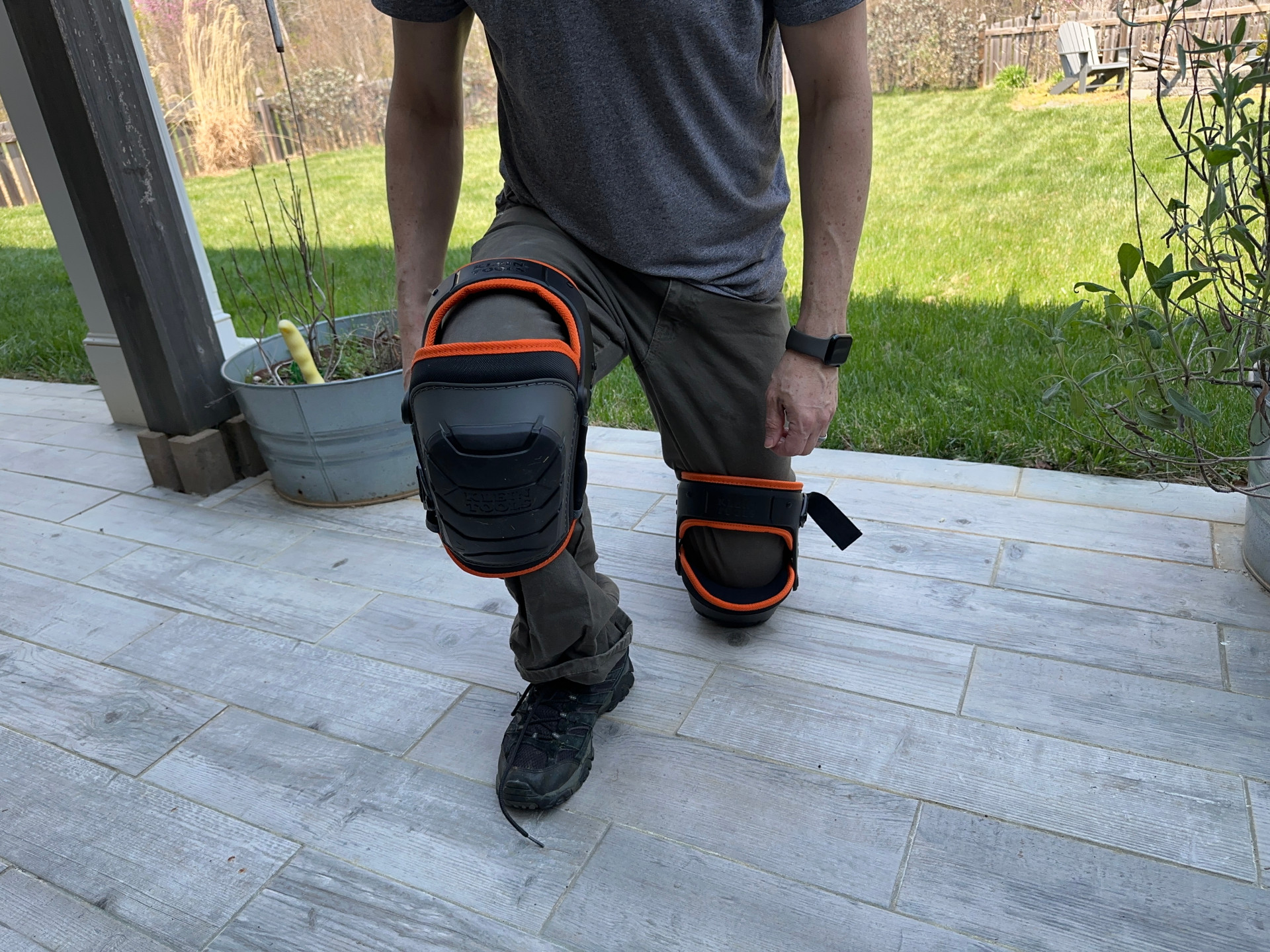 A person kneeling in Klein Tools knee pads during testing