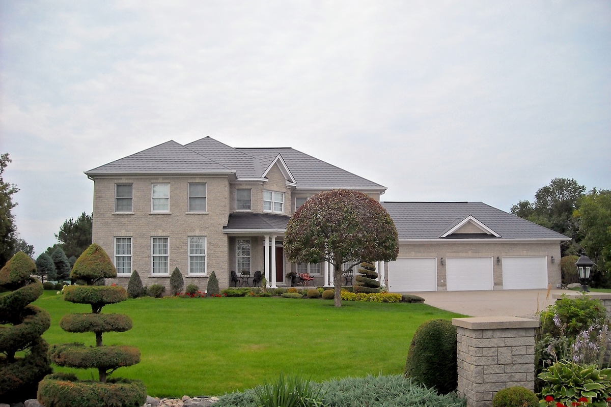 A slate-like metal roof on a Georgian-style house.