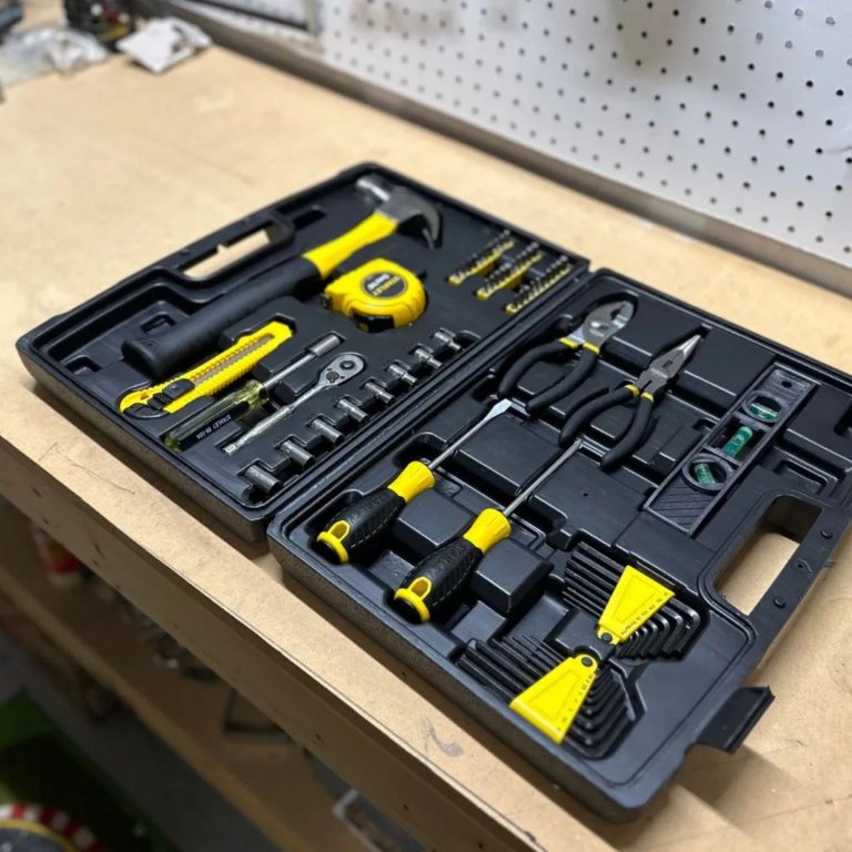 The Stanley 94-248 65-Piece Homeowner’s Tool Kit on a workbench before testing