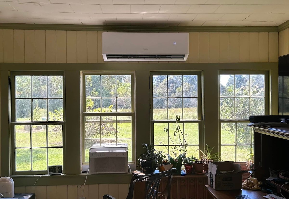 A Turbro mini-split air conditioning system installed in a home office.