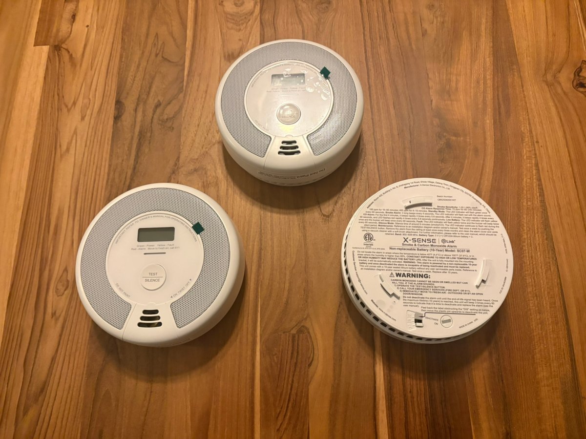 The X-Sense Smoke and CO alarms on a table before testing