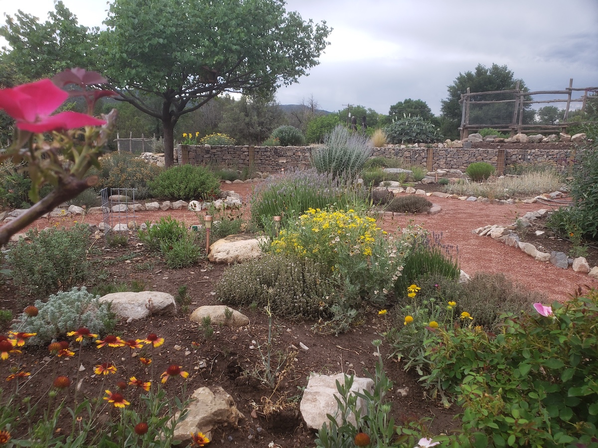A garden with several gravel paths and large boulders.