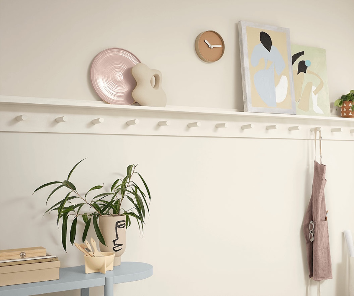 A hallways with built-in coat rack painted in Sherwin William's "Alabaster" paint. 