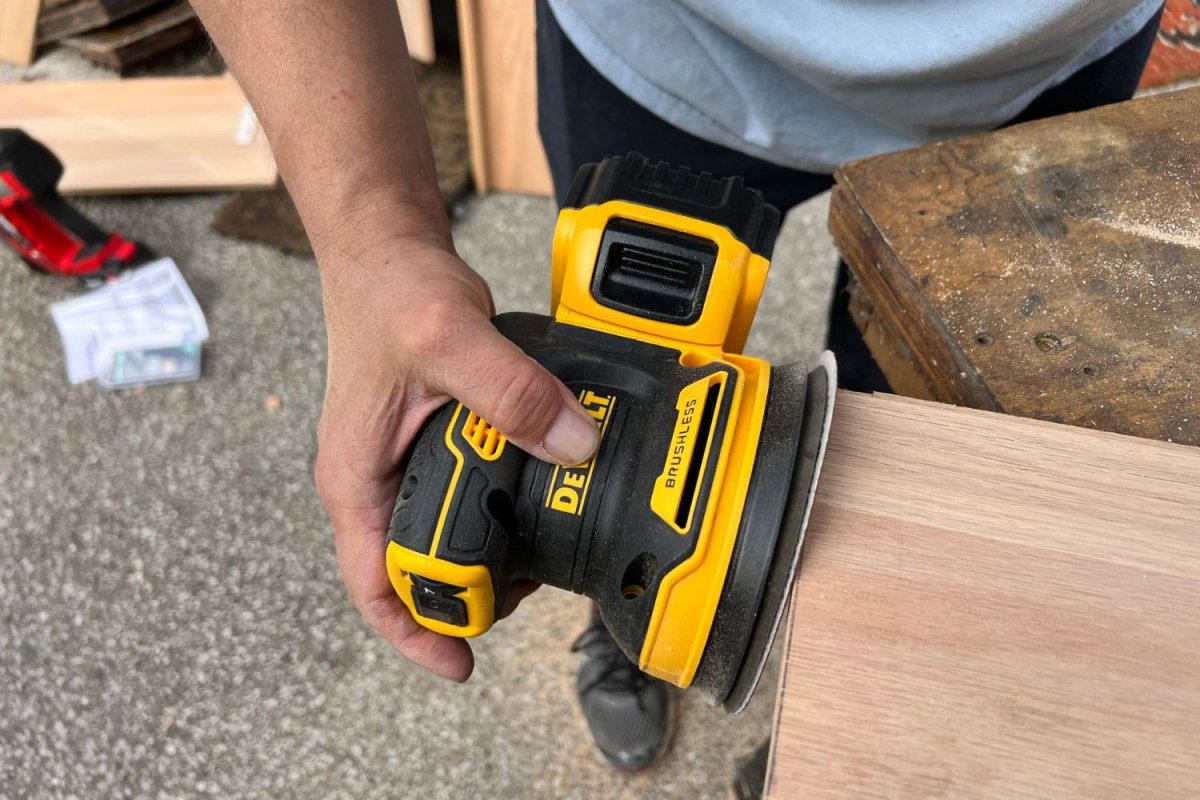 a person using one of the models of 7-Tool DeWalt Combo Kit
