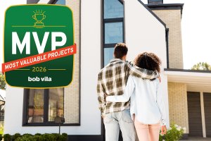 A couple looking at the front of their house for curb appeal.