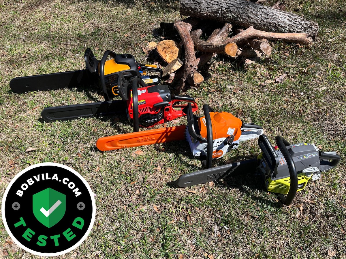 A group of the best gas chainsaws next to a pile of wood during testing