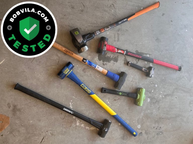 A group of the best sledgehammers on a garage floor during testing