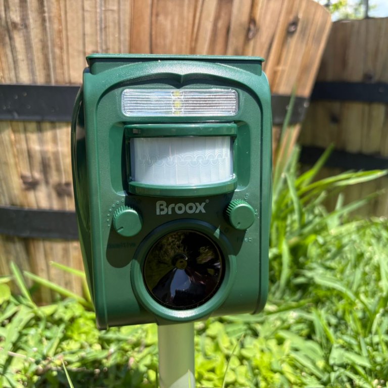 The Broox Solar Animal Repellent in a yard during testing