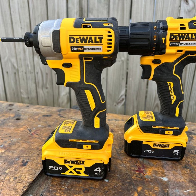 Two tools from the DeWalt Combo Kit on a workbench during testing