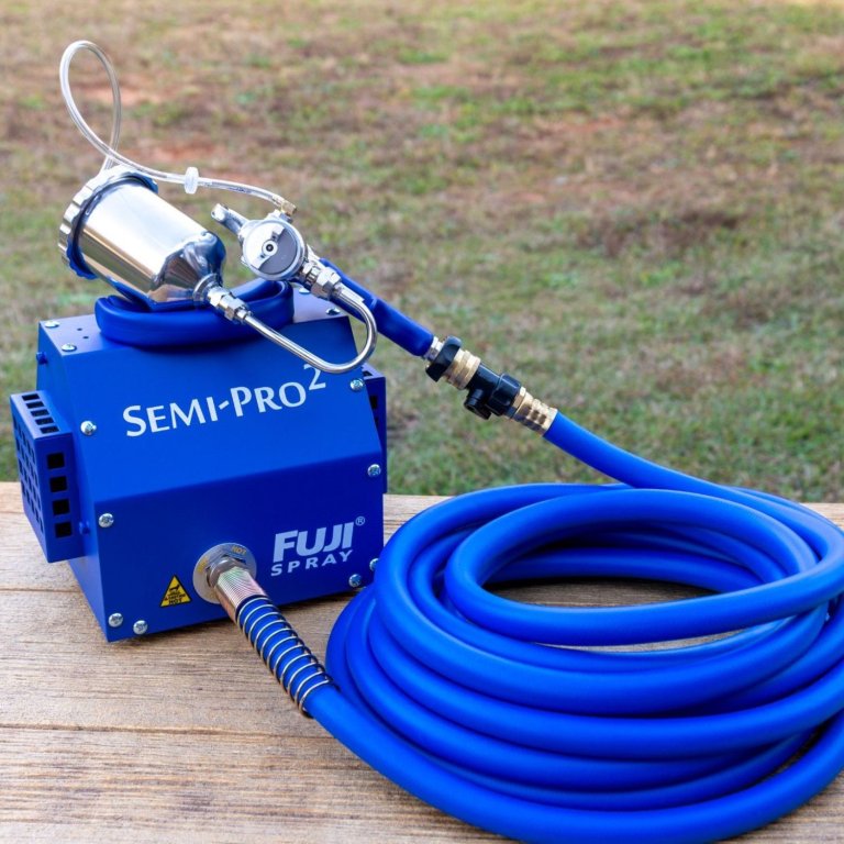 The Fuji Semi-Pro 2 Gravity Paint Sprayer System on an outdoor table before testing