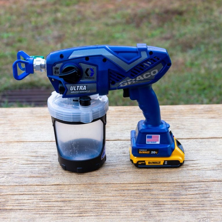 The Graco Ultra Cordless Handheld Airless Paint Sprayer on an outdoor table before testing