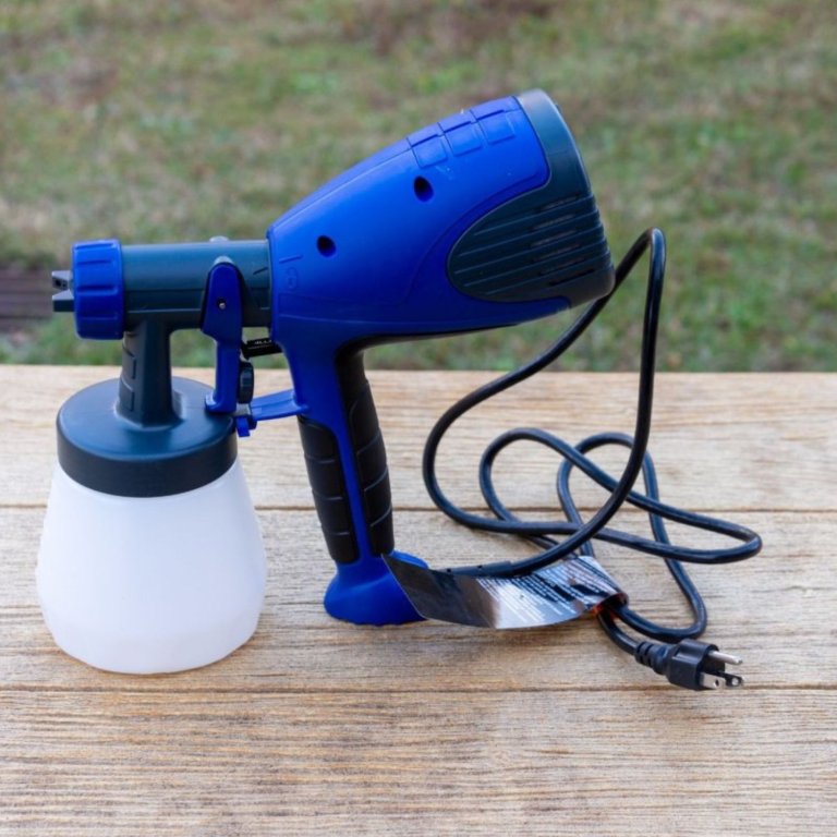 The HomeRight Quick Finish HVLP Paint Sprayer on an outdoor table during testing