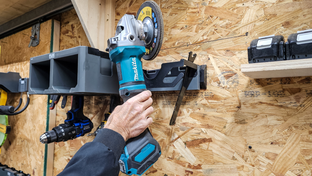 Putting a grinder in its holder while testing the FLEX storage system