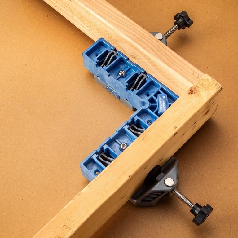 A Rockler Corner Clamping Jig holding two lengths of wood in place to form a perfectly square joint