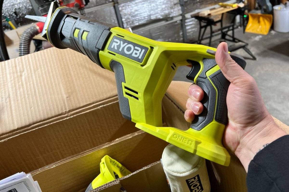 A product tester unboxing the Ryobi jigsaw 