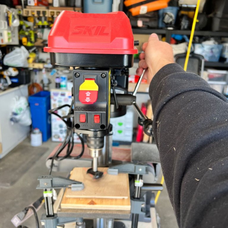 A product tester using the Skil drill press