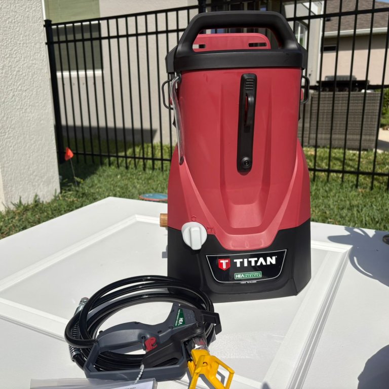 The Titan ControlMax 1650 18V Paint Sprayer on a painted cabinet door during testing