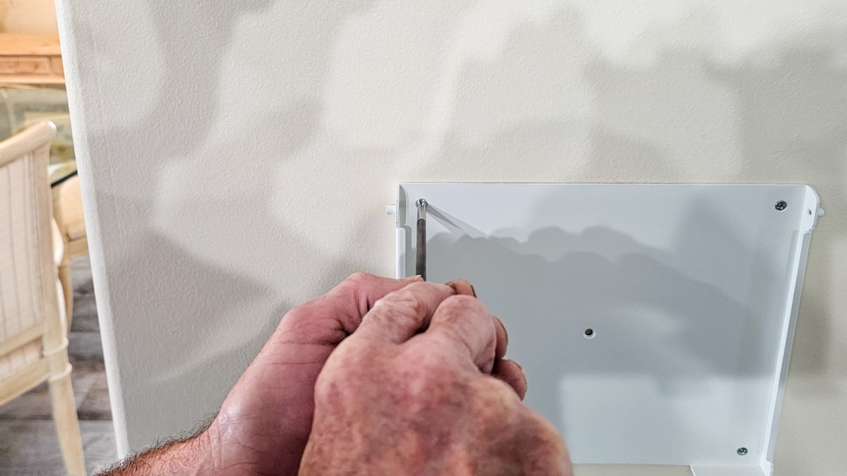 Using screwdriver to install flush-mount bracket