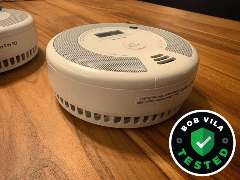 The X-Sense smoke alarm on a table before installation and testing