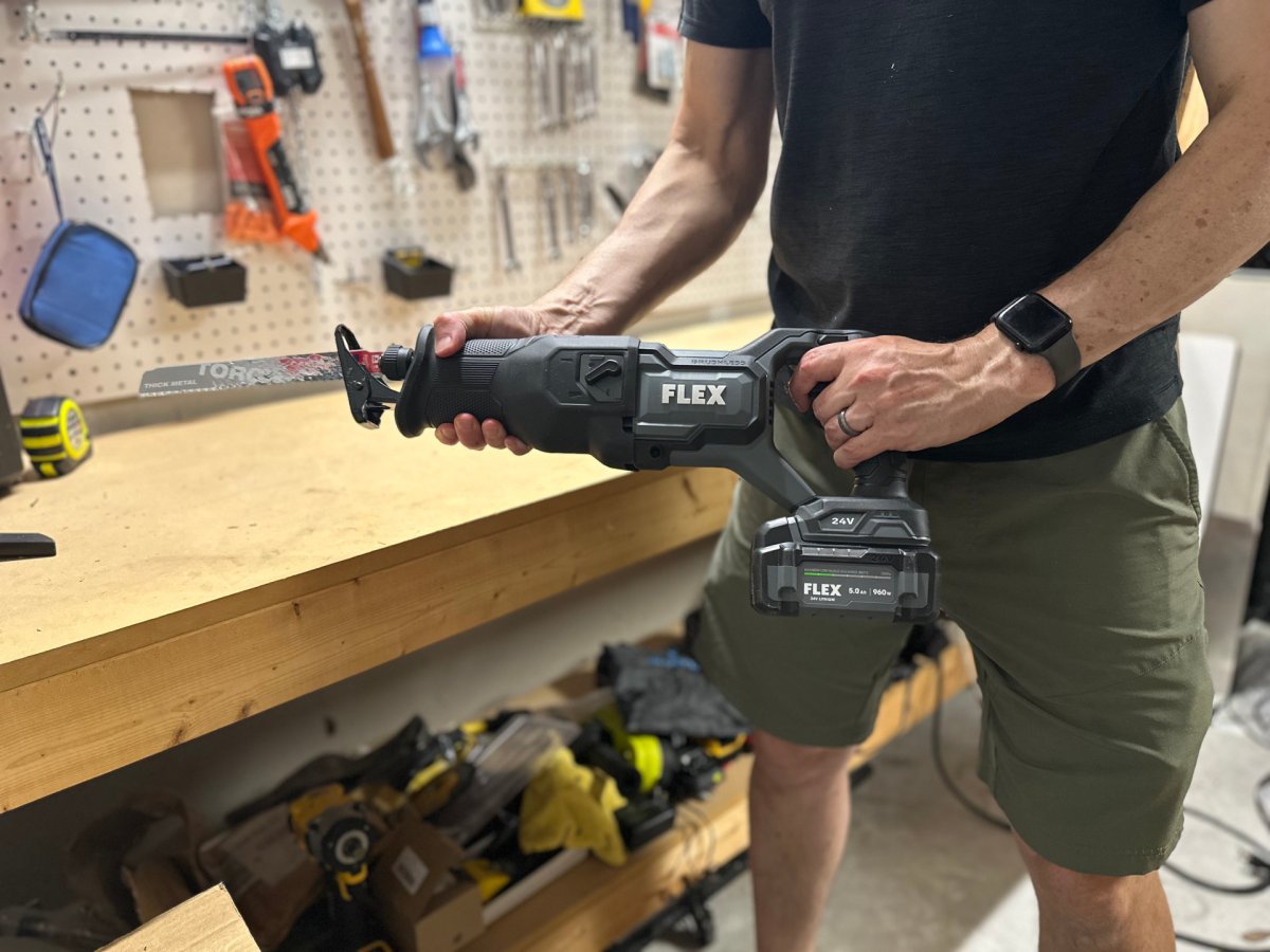 a person holding Flex Brushless FX2271 Reciprocating Saw