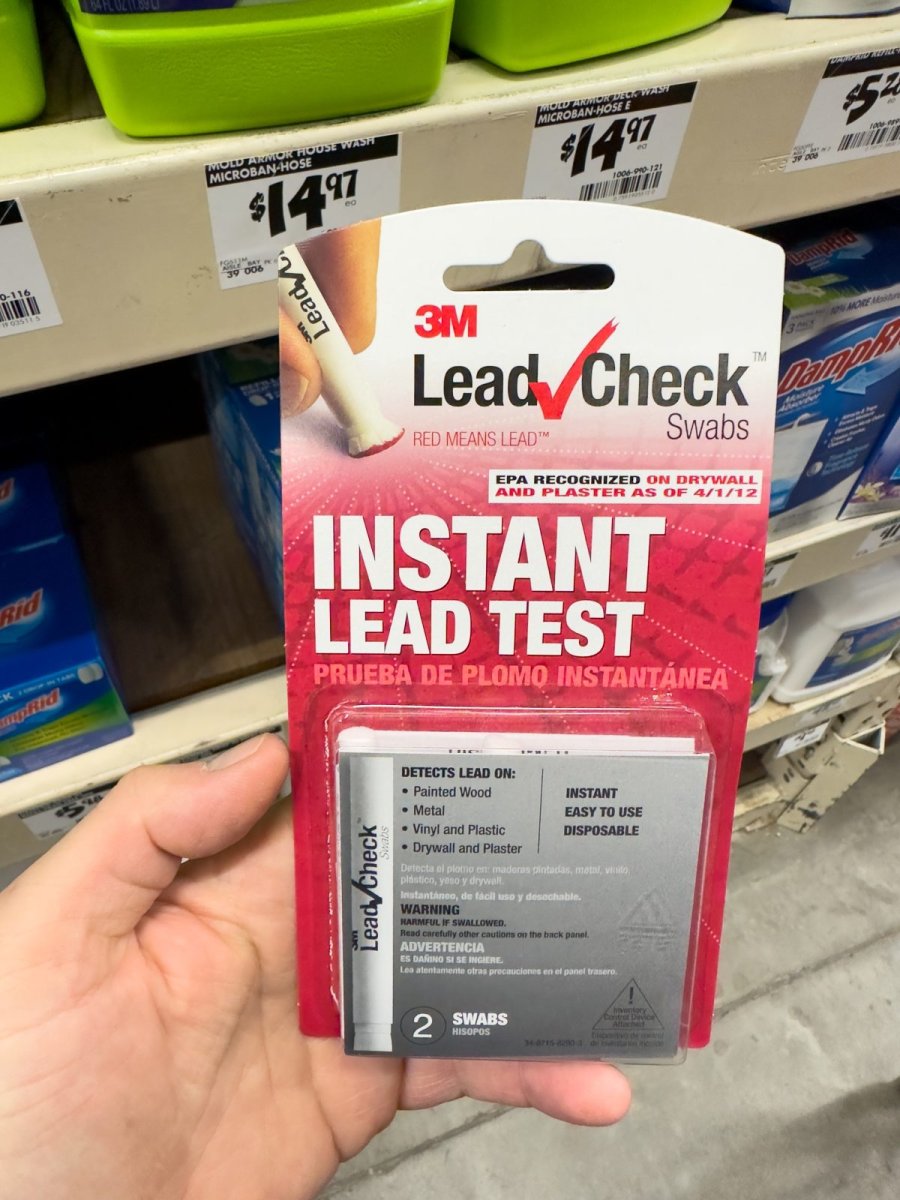 Hand holding an instant lead test in a store