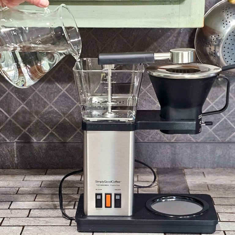 Adding water to SimplyGoodCoffee brewer during testing