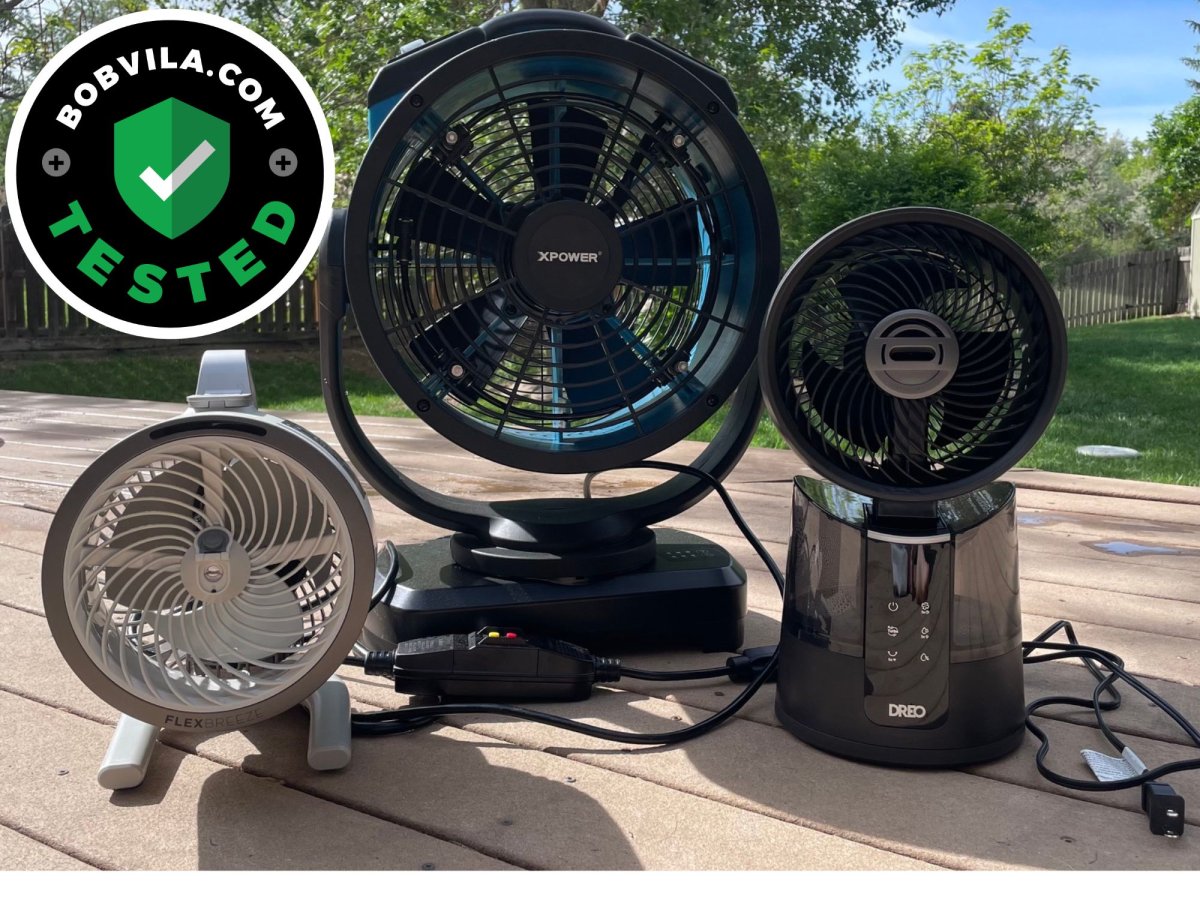 3 of the Best Outdoor Misting Fans on a deck before testing